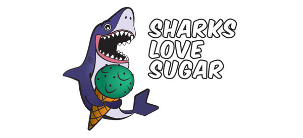 Cartoon shark enjoying an ice cream cone at KubeCon, with the text "Sharks Love Sugar" beside it.